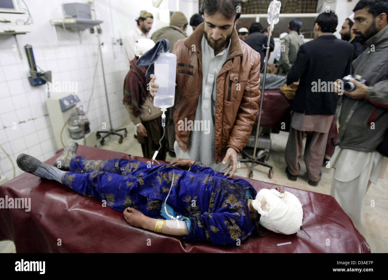 Victim of Orakzai Agency bomb blast being admitted at  Lady Reading Hospital for treatment, in Peshawar on Thursday, February 14, 2013. At least five  people have been killed while nine others injured in a landmine blast in Hassan Dara area of  Orakzai Agency. Stock Photo