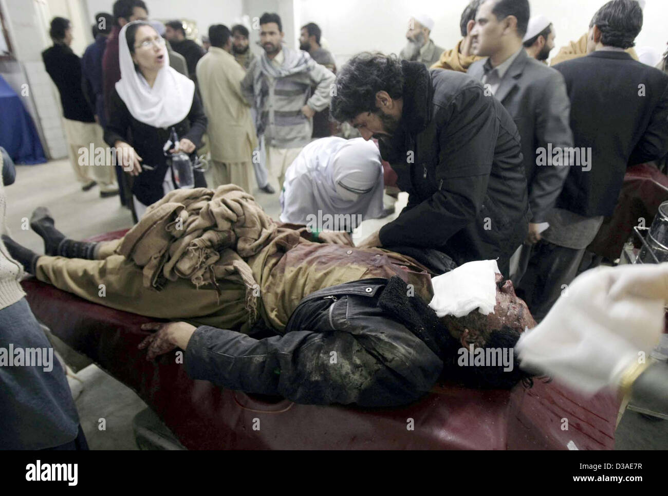 Victim of Orakzai Agency bomb blast being admitted at  Lady Reading Hospital for treatment, in Peshawar on Thursday, February 14, 2013. At least five  people have been killed while nine others injured in a landmine blast in Hassan Dara area of  Orakzai Agency. Stock Photo