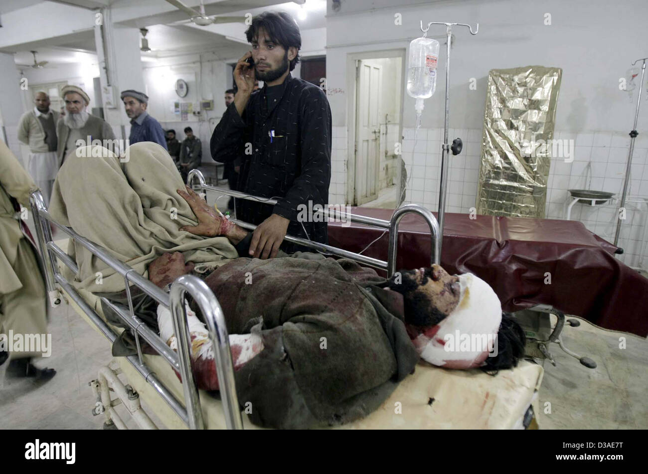 Victim of Orakzai Agency bomb blast being admitted at  Lady Reading Hospital for treatment, in Peshawar on Thursday, February 14, 2013. At least five  people have been killed while nine others injured in a landmine blast in Hassan Dara area of  Orakzai Agency. Stock Photo