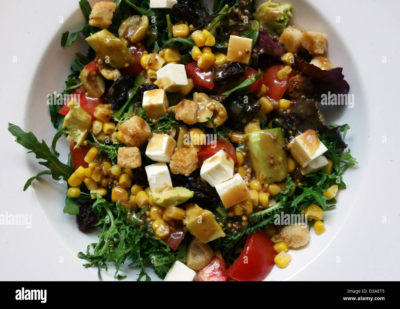 Dressed salad with cheese and avocado in Spanish restaurant in Tenerife