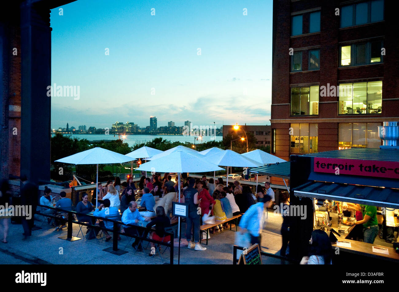 USA, New York, New York City, Manhattan, West Side, Meat Packing District, High Line Elevated Park Restaurant at Sunset Stock Photo