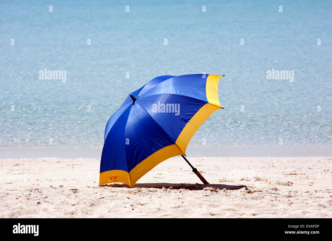 Blue beach umbrella on a beach Stock Photo Alamy