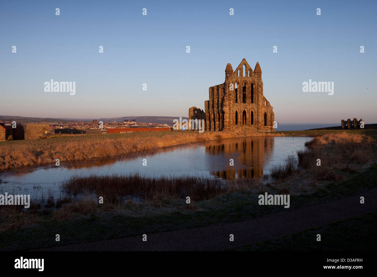 Whitby Abbey is a ruined Benedictine abbey overlooking the North Sea on the East Cliff above Whitby in North Yorkshire, England. Stock Photo