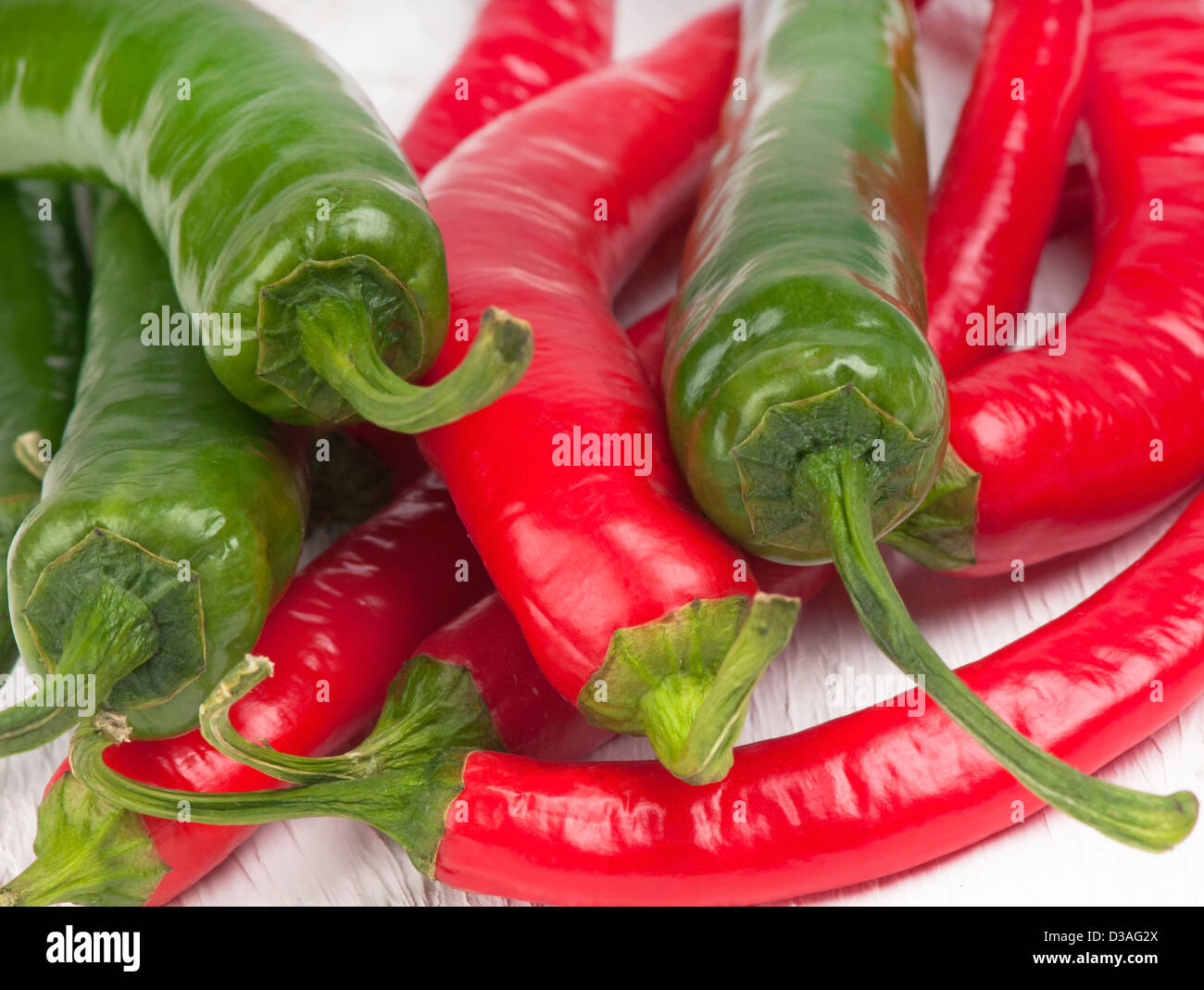 Macro of a pile of red and green hot chilli peppers. Stock Photo