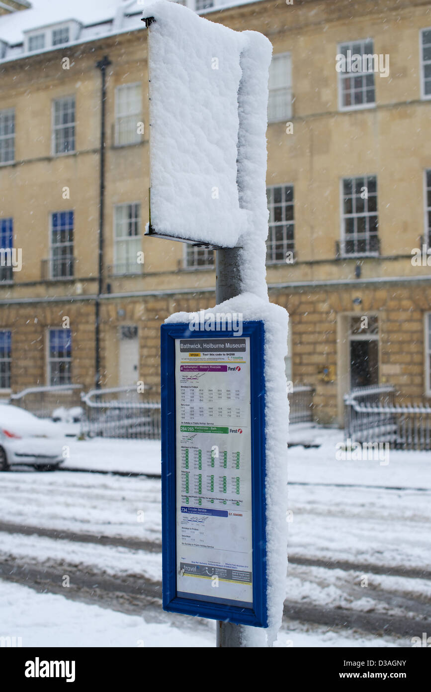 Bus Timetable covered in Snow Stock Photo