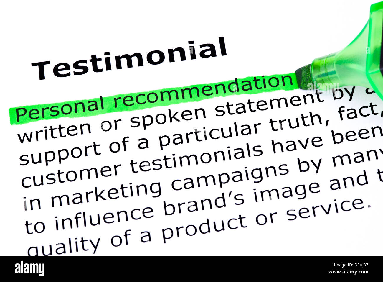 Definition of the word Testimonial, Personal Recommendation highlighted with green marker. Stock Photo