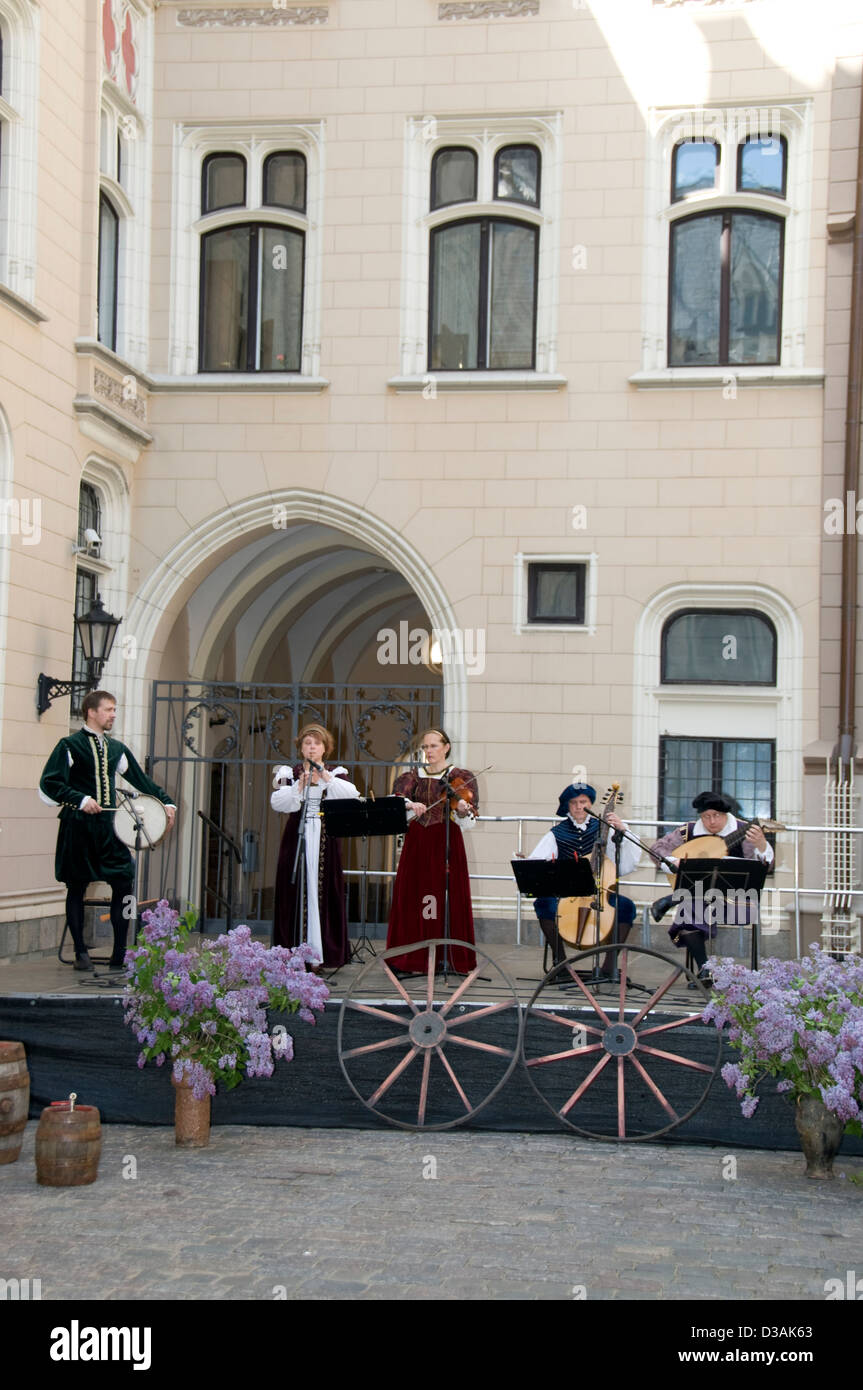 A Latvian medieval musical group performing on an open-air stage as part of the annual Latvian cultural festival in Riga, Latvia Stock Photo