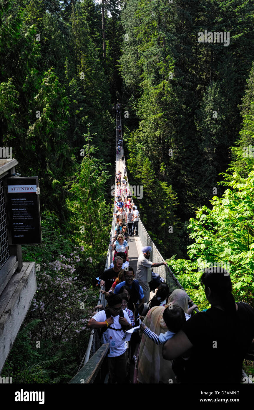 Tourists on the suspended bridge at Capilano Suspension Bridge Park