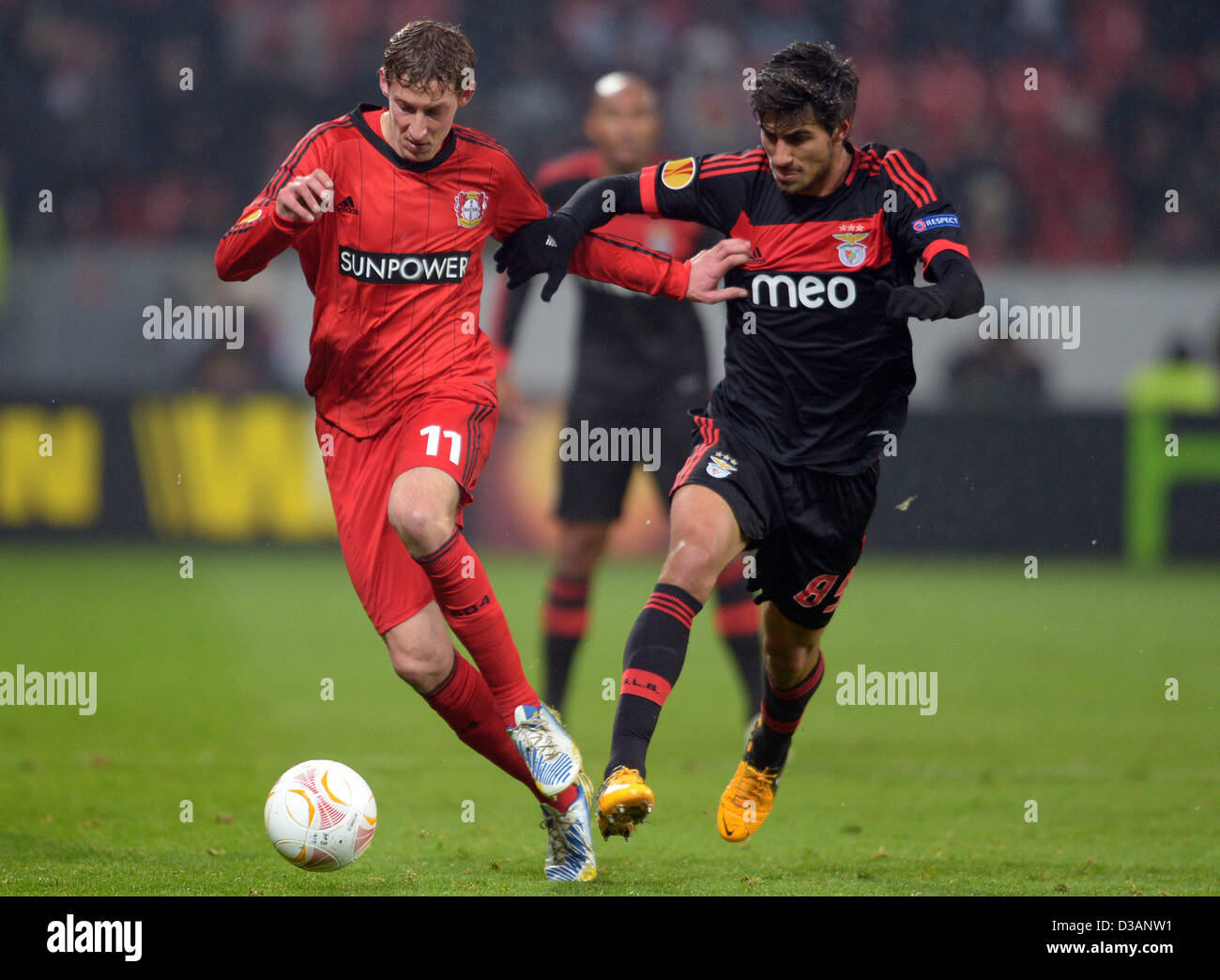 Leverkusen's Stefan Kiessling and Andre Gomes of Benfica vie for the ball during the UEFA Europa League round of 32 first leg soccer match between Bayer Leverkusen and Benfica Lisbon at at BayArena stadium in Leverkusen, Germany, 14 February 2013. Photo: Federico Gambarini/dpa Stock Photo