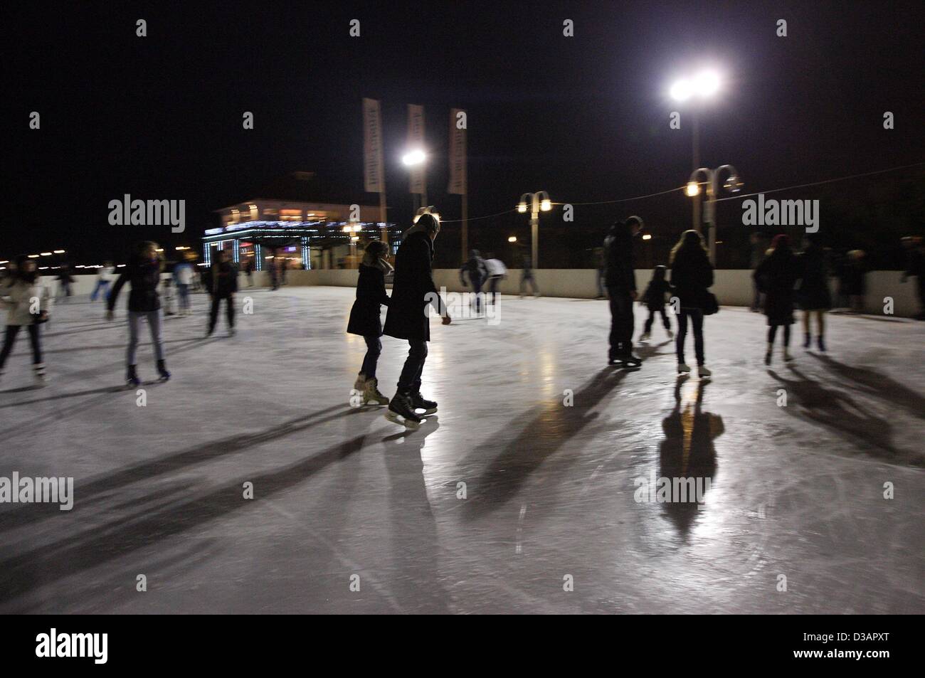 Sopot, Poland 14th, February 2013   Sopot's citizens enjoy ice skiting on the open-air skiting rink  near the Sopot's Pier. Stock Photo