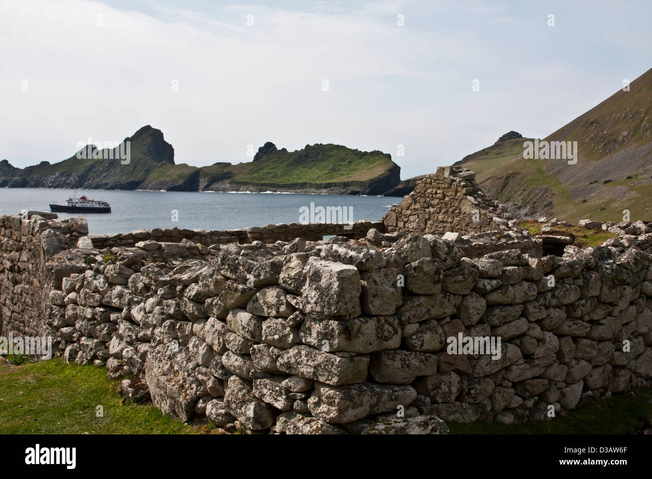 Ruins of a cottage from the nineteenth century on Hirta, St Kilda archipelago, with the island of Dun, Village harbor, Isle Dun Stock Photo