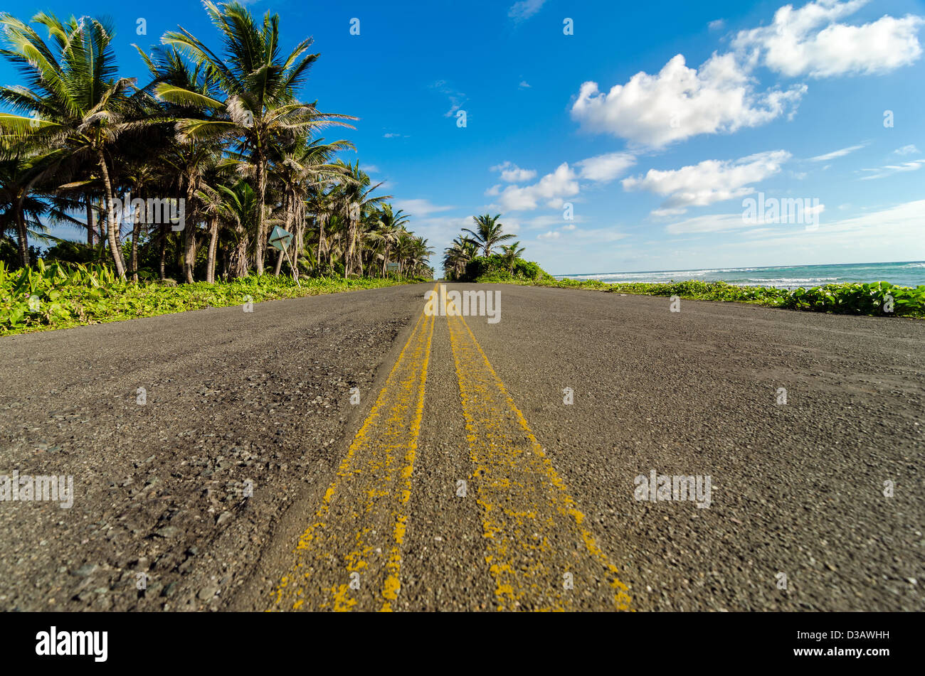 View of Caribbean coastal road in San Andres, Colombia at a low angle Stock Photo
