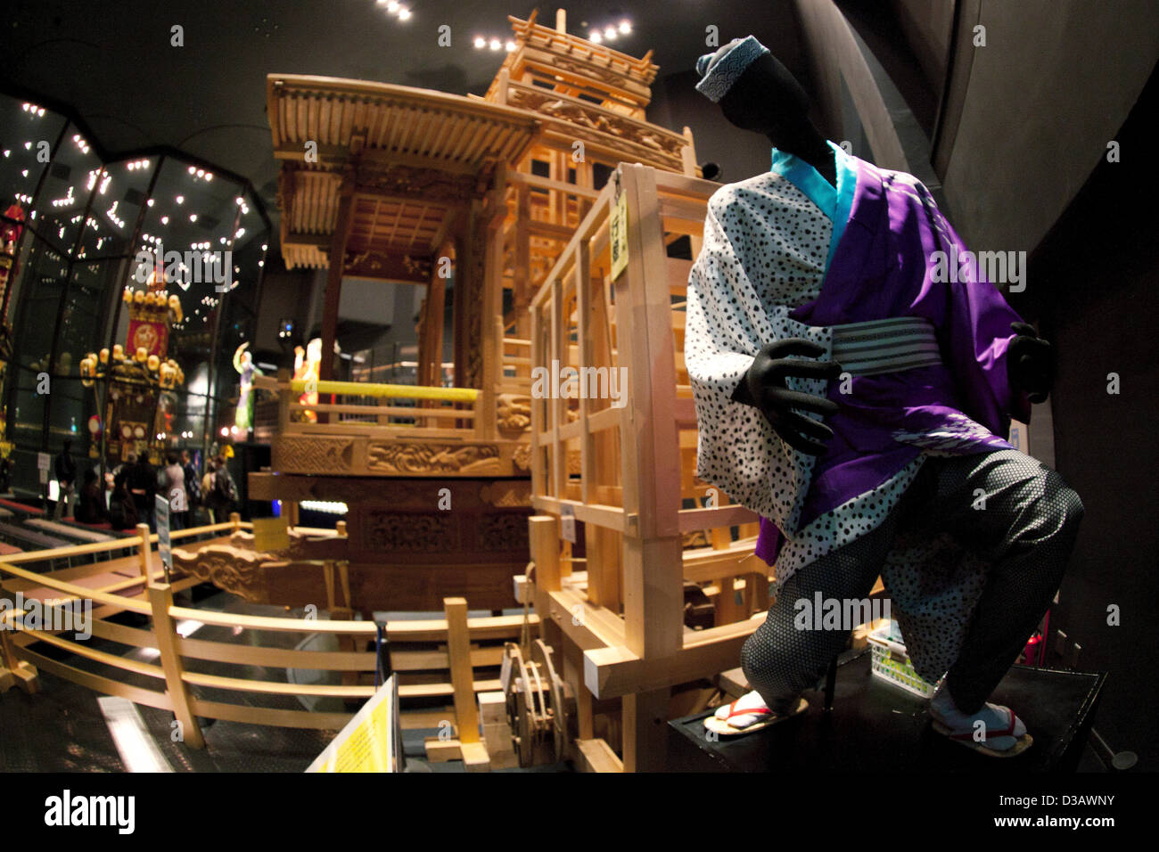 February 14, 2013, Kawagoe, Japan - A doll wearing traditional Japanese clothes and dashi (portable shrine) structure at the Kawagoe Festival Museum. An old town from Edo Period (1603-1867) is located in Kawagoe, 30 minutes by train from central Tokyo. In the past Kawagoe was an important city for trade and strategic purpose, the shogun installed some of their most important loyal men as lords of Kawagoe Castle. Every year "Kawagoe Festival" is held in the third weekend of October, people pull portable shrine during the parade, later "dashi" floats on the streets nearby. The festival started 3 Stock Photo