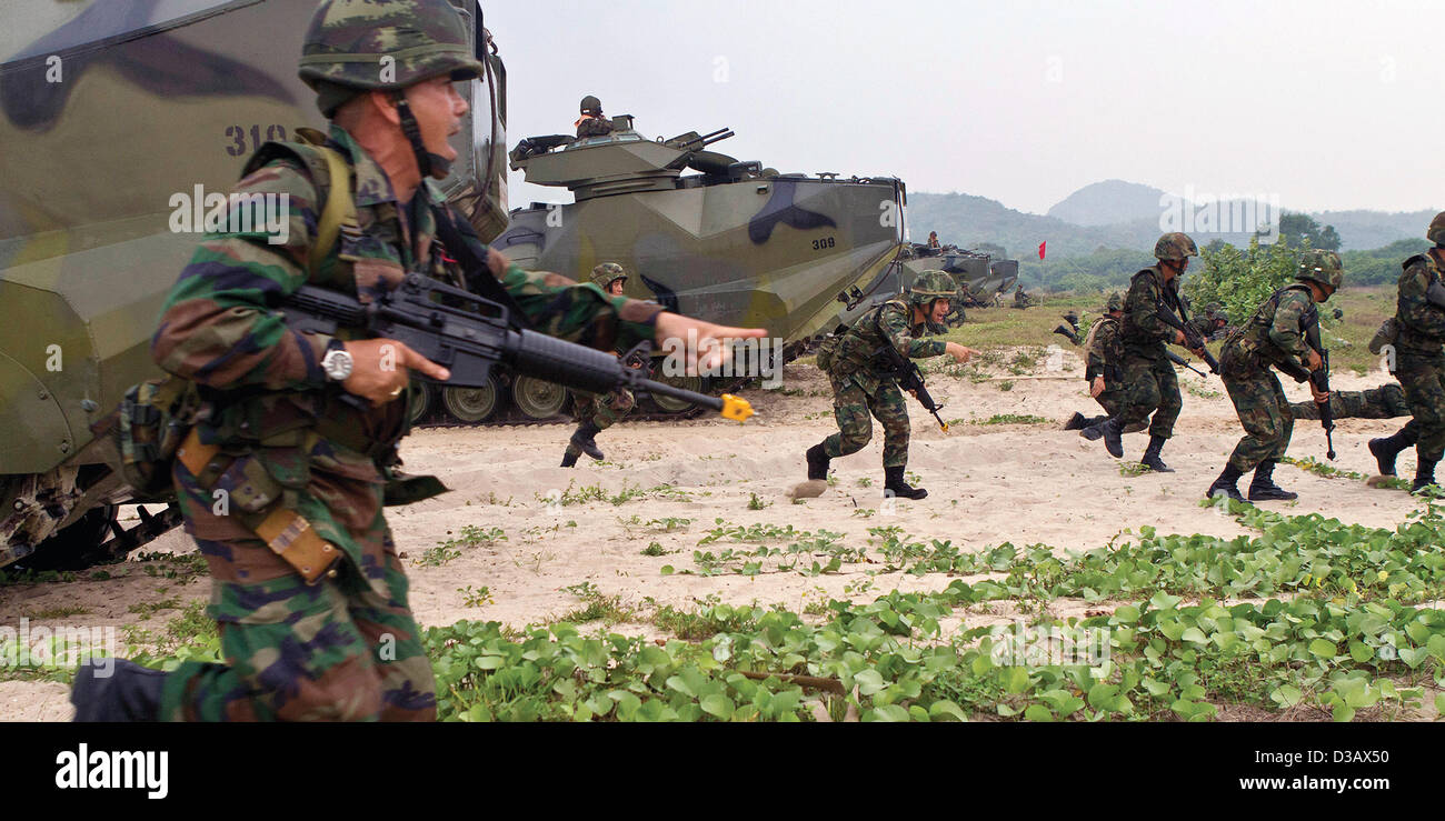 Royal Thai Marines move up the beach during an amphibious assault exercise during Cobra Gold 2013 February 13, 2013 in Hat Yao, Thailand. Cobra Gold is an annual event with the United States and Kingdom of Thailand to increase readiness in the Asia-Pacific region. Stock Photo