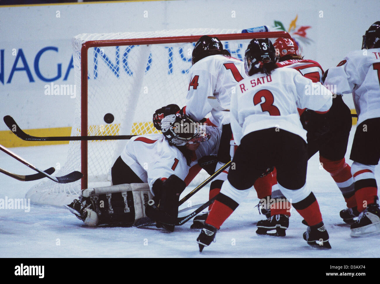 (L-R) Yuka Oda, Yukari Ono, Rie Sato (JPN), FEBRUARY 8, 1998 - Ice Hockey : Nagano 1998 Olympic Winter Games, Women's preliminary round match between Canada 13-0 Japan at Aqua Wing in Nagano, Japan. (Photo by Norio Takazawa/AFLO SPORT) Stock Photo