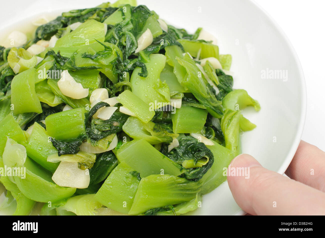 Serving a dish of vegetable Stock Photo Alamy