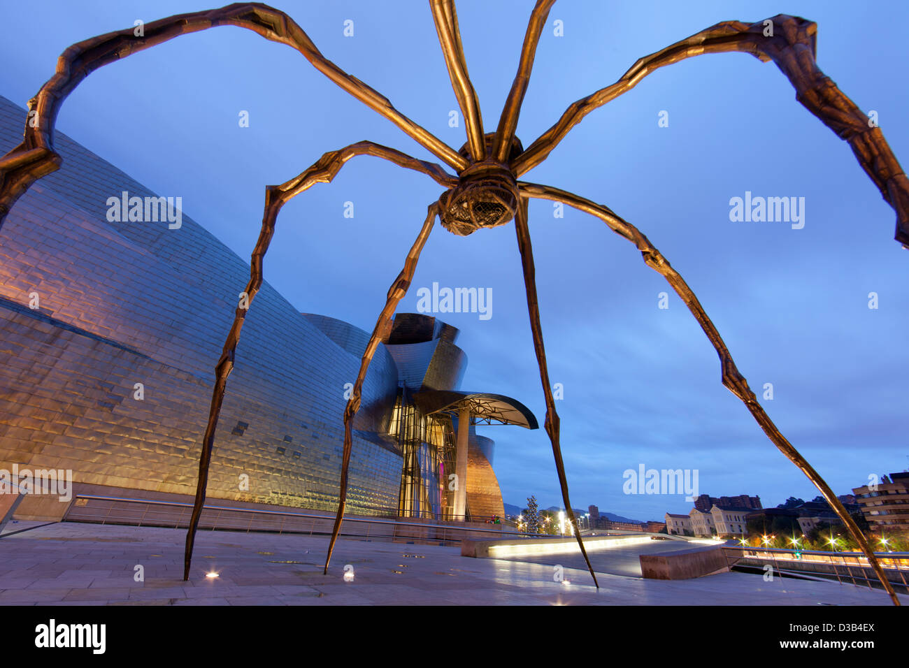 The Guggenheim Museum and spider statue at dusk, Bilbao, Biscay 