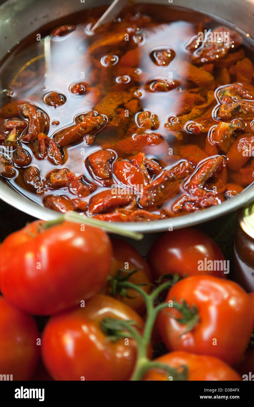 Sundried tomatoes soaking in oil at Borough Market in London SE1 UK