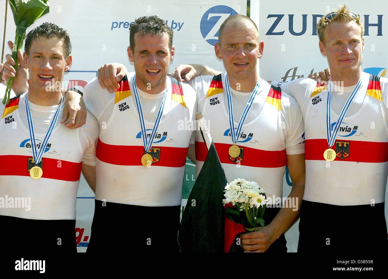 (dpa) - The German quadruple scull team pose with their gold medals after the Rowing World Championships in Seville, Spain, 22 September 2002. L-R: Rene Bertram, Stephan Volkert, Marco Geisler and Robert Sens. Stock Photo