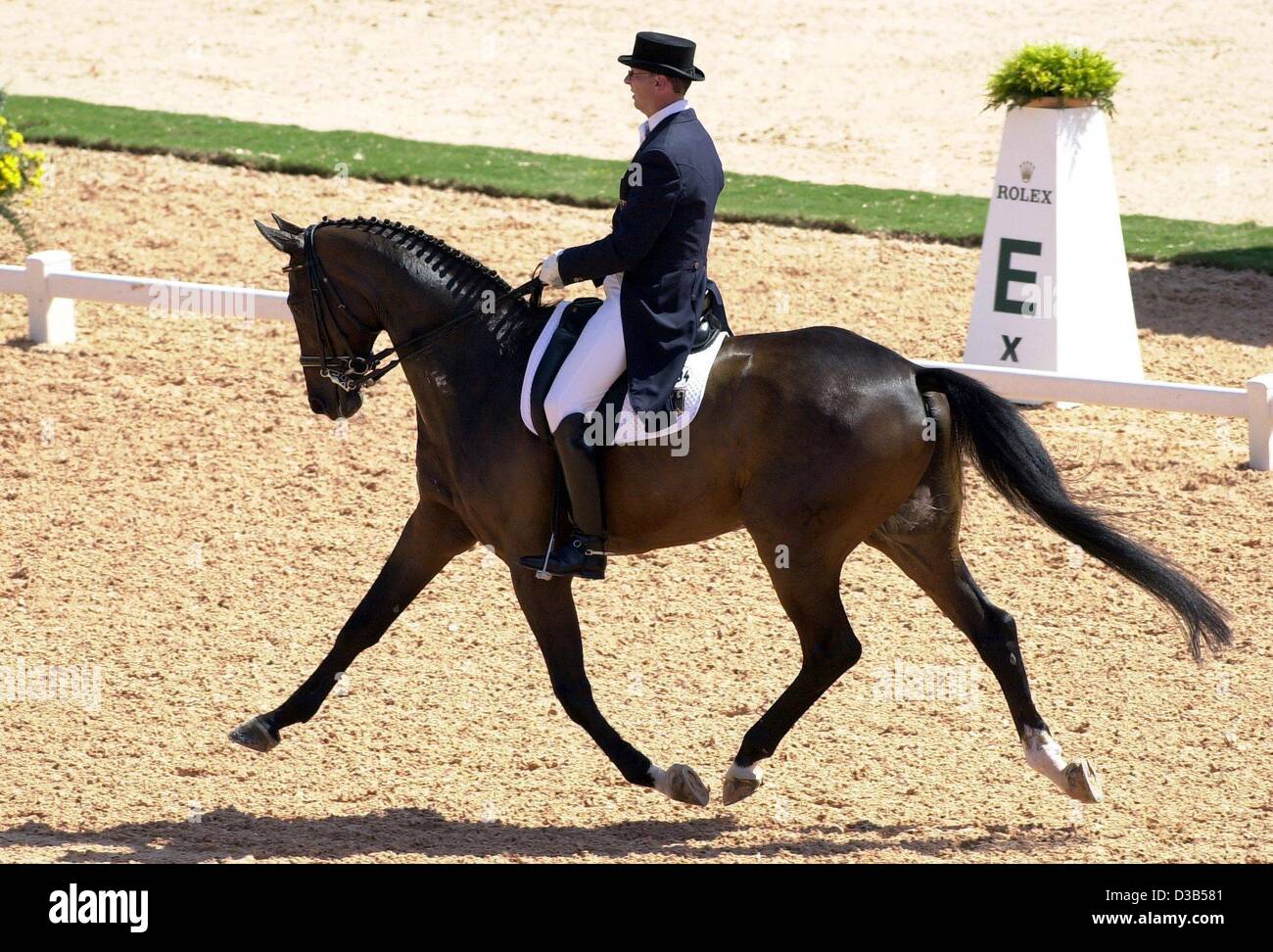 (dpa) - German rider Klaus Husenbeth performs with his horse 'Piccolino' during the dressage event at the World Equestrian Games in Jerez, Spain, 13 September 2002. Stock Photo