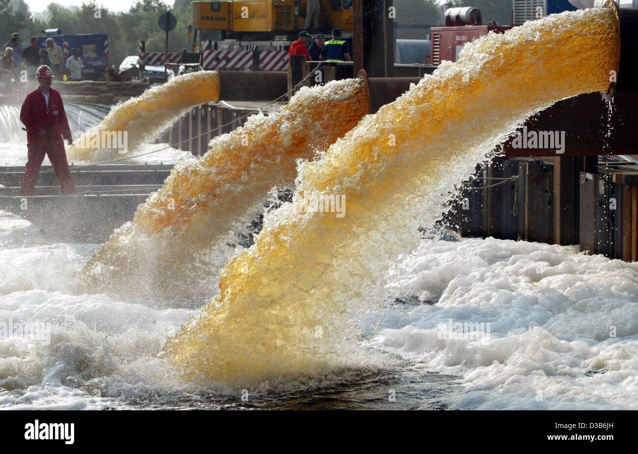 (dpa) - The water of the river Elbe is pumped into the Elbe Jeetzel Canal in order to protect the city of Dannenberg, Germany, from being overflooded, 22 August 2002. The water pressure against the soaking-wet dykes is still a big threat. Stock Photo