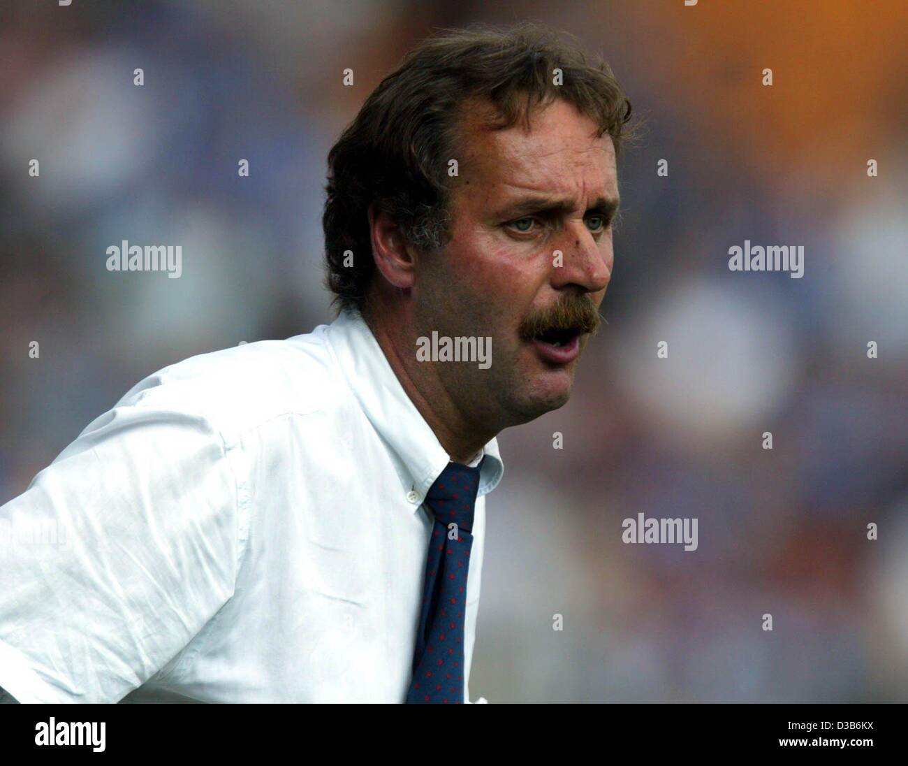 (dpa) - Peter Neururer, coach of the German soccer club VfL Bochum, watches tensely the match against Cottbus in Bochum, Germany, 17 August 2002. The match ended 5:0 for Bochum, putting Bochum at the top of the league table. Stock Photo