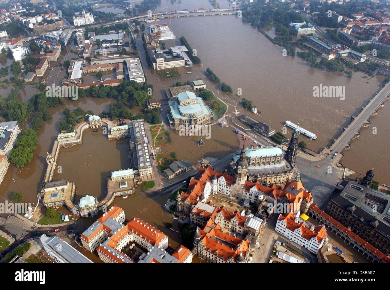 (dpa) - The place in front of the famous opera house 'Semperoper' (C) and the court yard of the 'Zwinger', the ward (L), in Dresden, Germany, are completely flooded, 17 August 2002. For the first time since days the level of the water did not rise any more. But the weather forecast predicts rain and Stock Photo