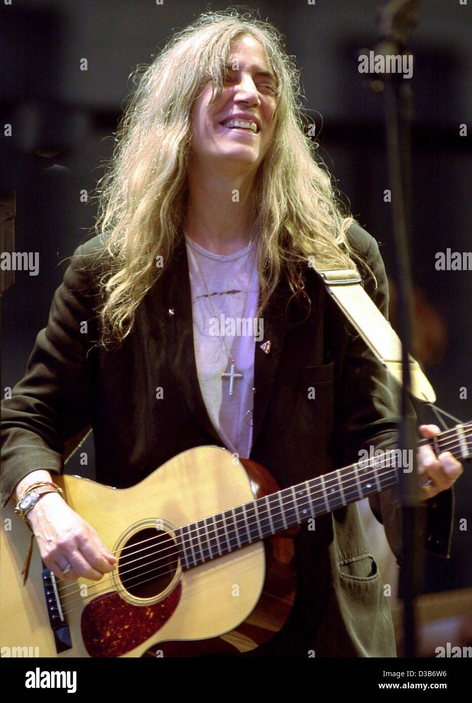 (dpa) - US rock singer Patti Smith performs during an open air concert in Berlin, 9 August 2002. The 55 year old, who is currently touring Germany, said in an interview that she would like to live in Europe after her daughter has grown up. Stock Photo