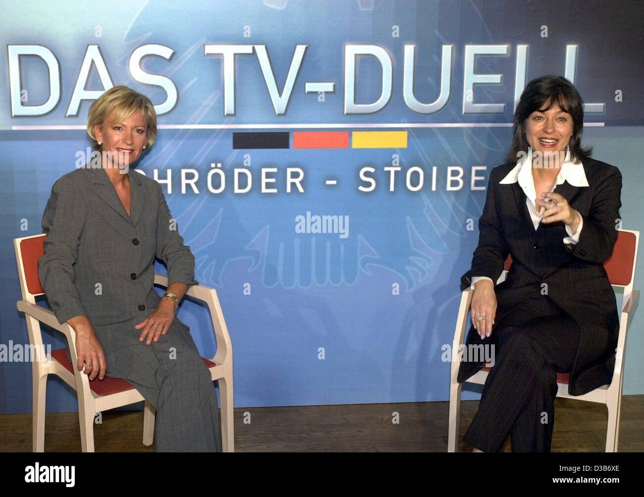 (dpa) - The TV hosts of the two main German public tv stations, Sabine Christiansen of ARD (L) and Maybrit Illner of ZDF, are 'testsitting' the chairs in the studio where the television duel of Chancellor Schroeder and his challenger Edmund Stoiber will be staged, pictured in Berlin, 7 August 2002.  Stock Photo