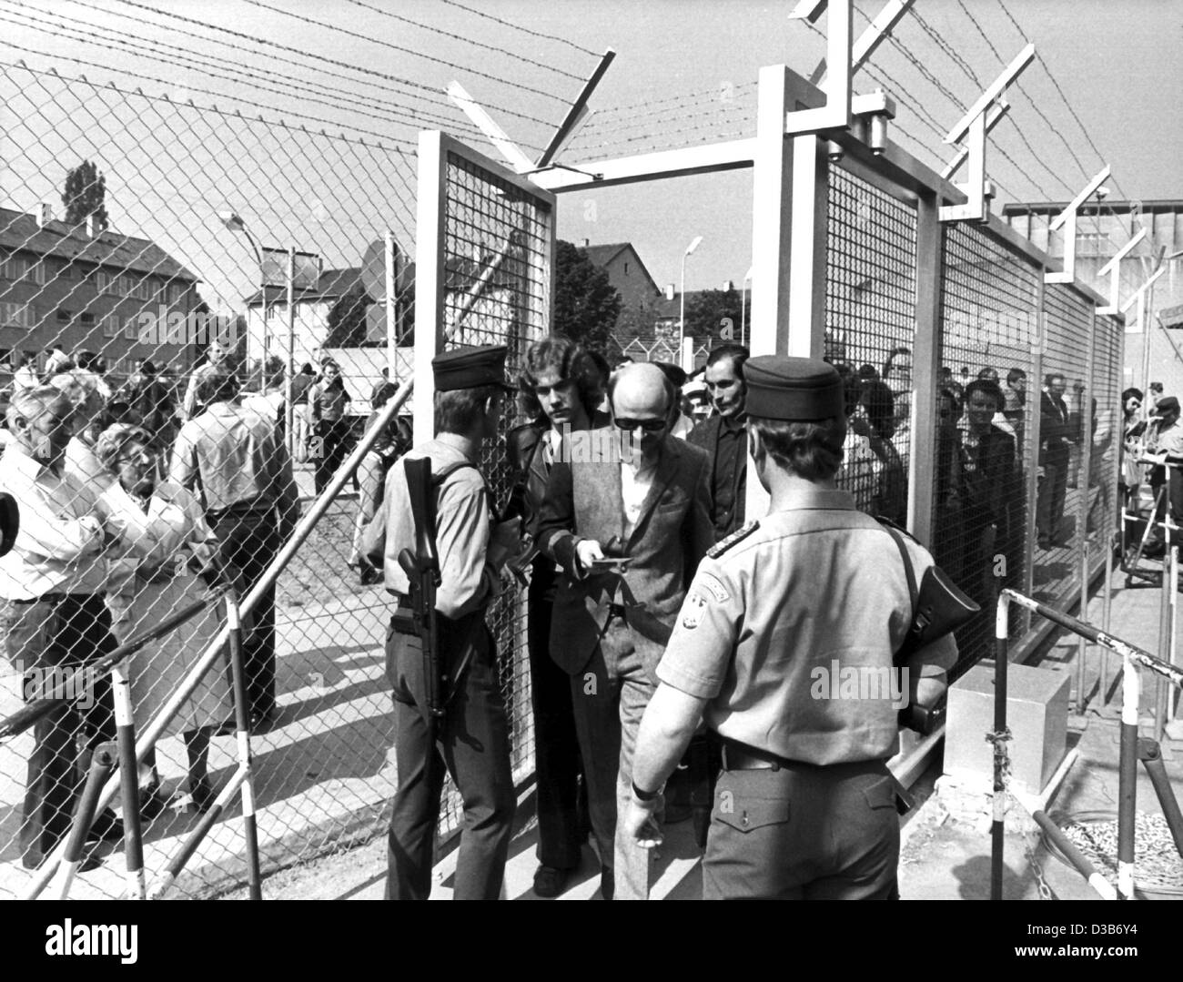 (dpa files) - Spectators are frisked before the start of the trial of the RAF terrorists Andreas Baader, Ulrike Meinhof, Gudrun Ensslin and Jan-Carl Raspe which is held in the prison in Stuttgart-Stammhein, 21 May 1975. After the longest trial in German history, Baader, Ensslin and Raspe were convic Stock Photo
