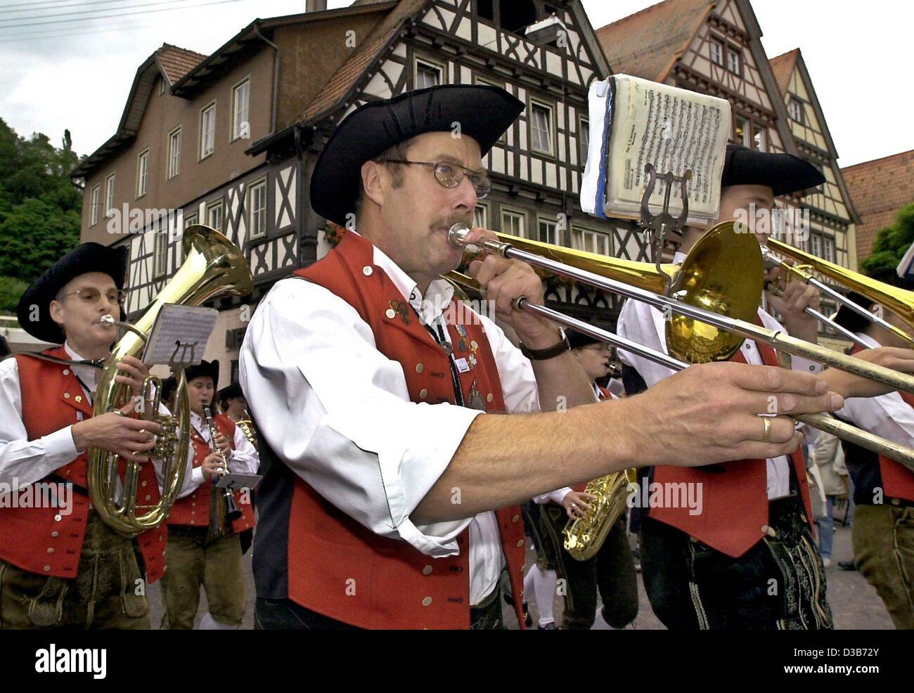 (dpa) - A traditional brass band marches through the city of Calw, Germany, celebrating its famous son, Nobel Prize laureate Hermann Hesse (1877-1962), 2 July 2002. The day marked the 125th birthday of the German author.  Hesse achieved international acknowledgement with novels like 'Siddharta' and  Stock Photo