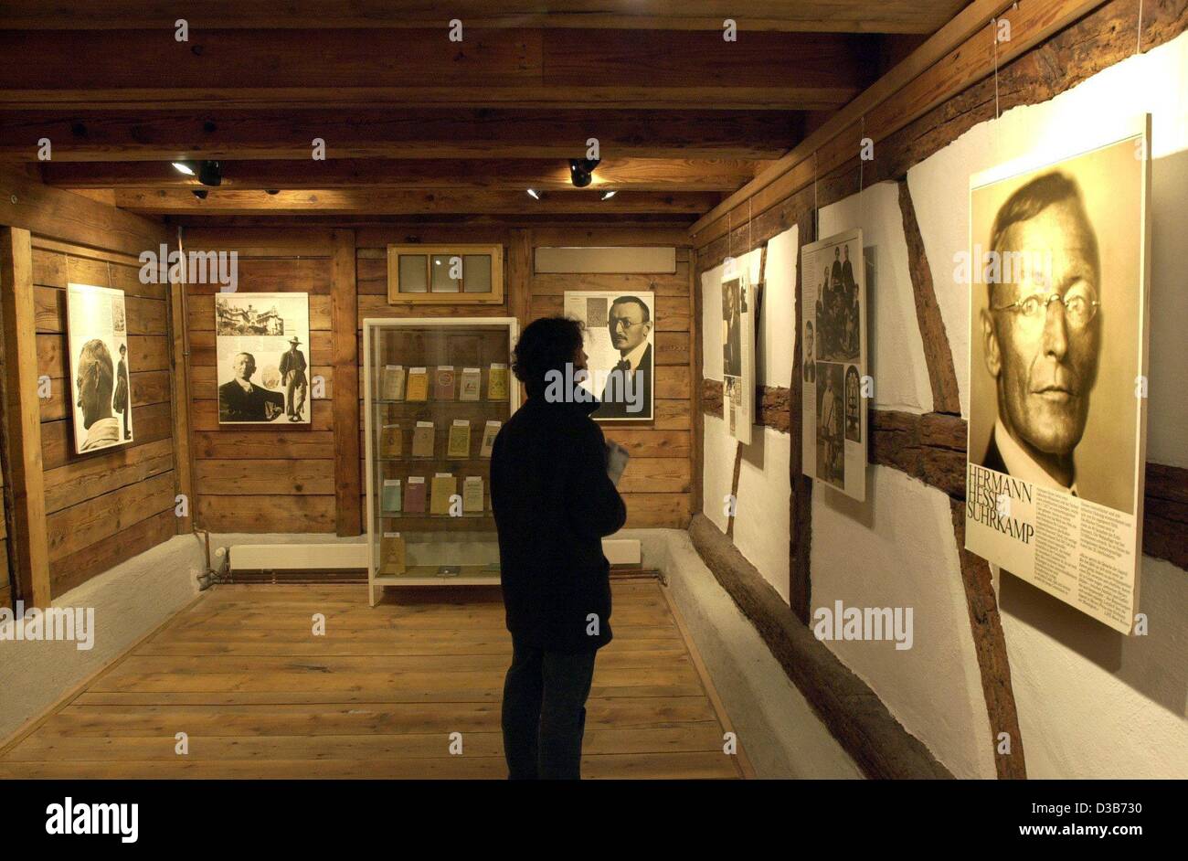 (dpa) - A visitor looks at the exhibition in the so-called 'Hesse-House' in Gaienhofen near Lake Constance, Germany, pictured 10 February 2002. German author and Nobel Prize laureate Hermann Hesse and his family lived in the village from 1904 till 1912, spending three years in this house. The half-t Stock Photo