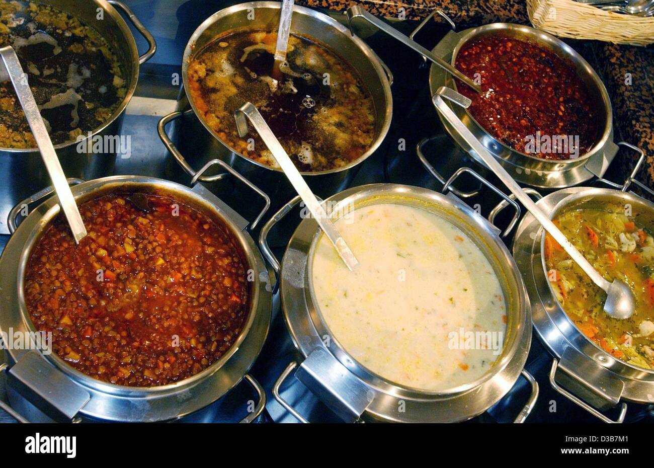 (dpa) Big pots full of colourful soups are offered in a soup bar in Munich, 13 December 2002