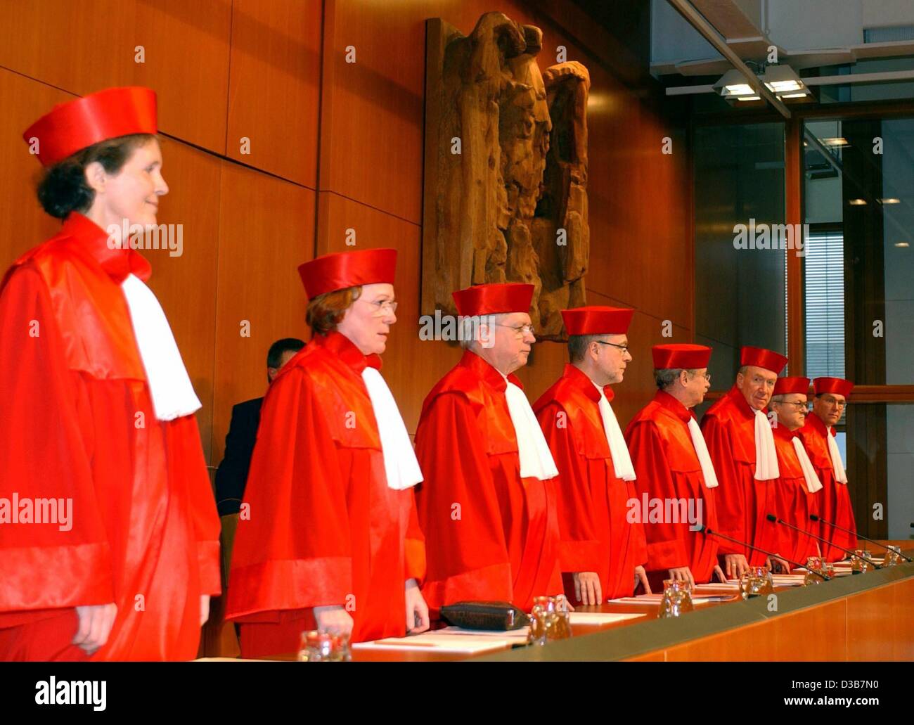 (dpa) - The second division of the Federal Constitutional Court, Gertrude Luebbe-Wolff, Lerke Osterloh, Hans-Joachim Jentsch, Udo Di Fabio, Vice President Winfried Hassemer, Bertold Sommer, Siegfried Bross and Rudolf Mellinghoff (L-R), are announcing their judgement on the immigration law by the red Stock Photo