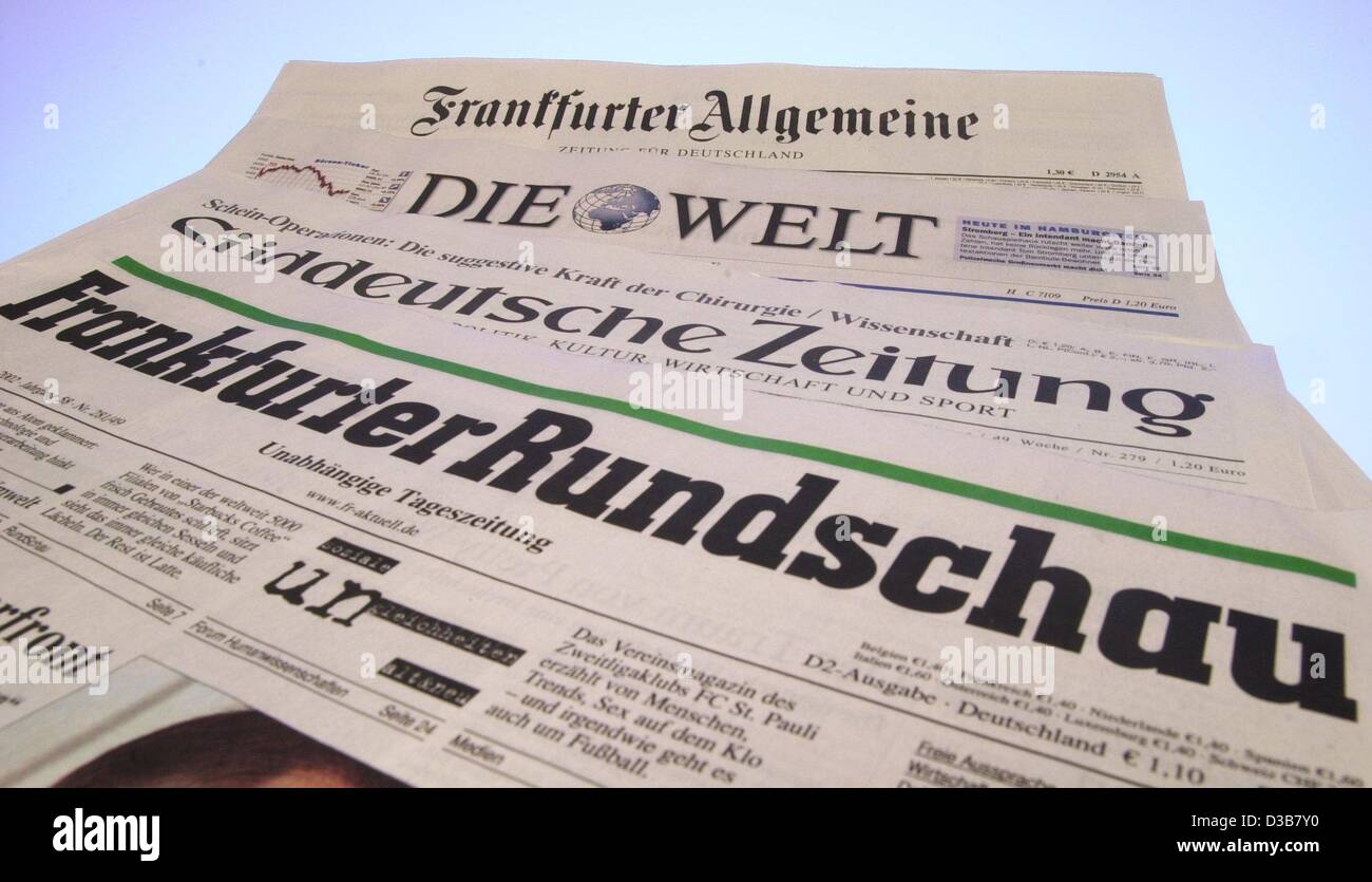 (dpa) - The photo shows four of the nationwide German newspaper laid out on a table, Hamburg, 12 December 2002. 2002 has been a dark year for the media. The  reduction of advertising has led to cuts in employment also in the renowned newspapers. Advertising usually makes up for two thirds of the rev Stock Photo