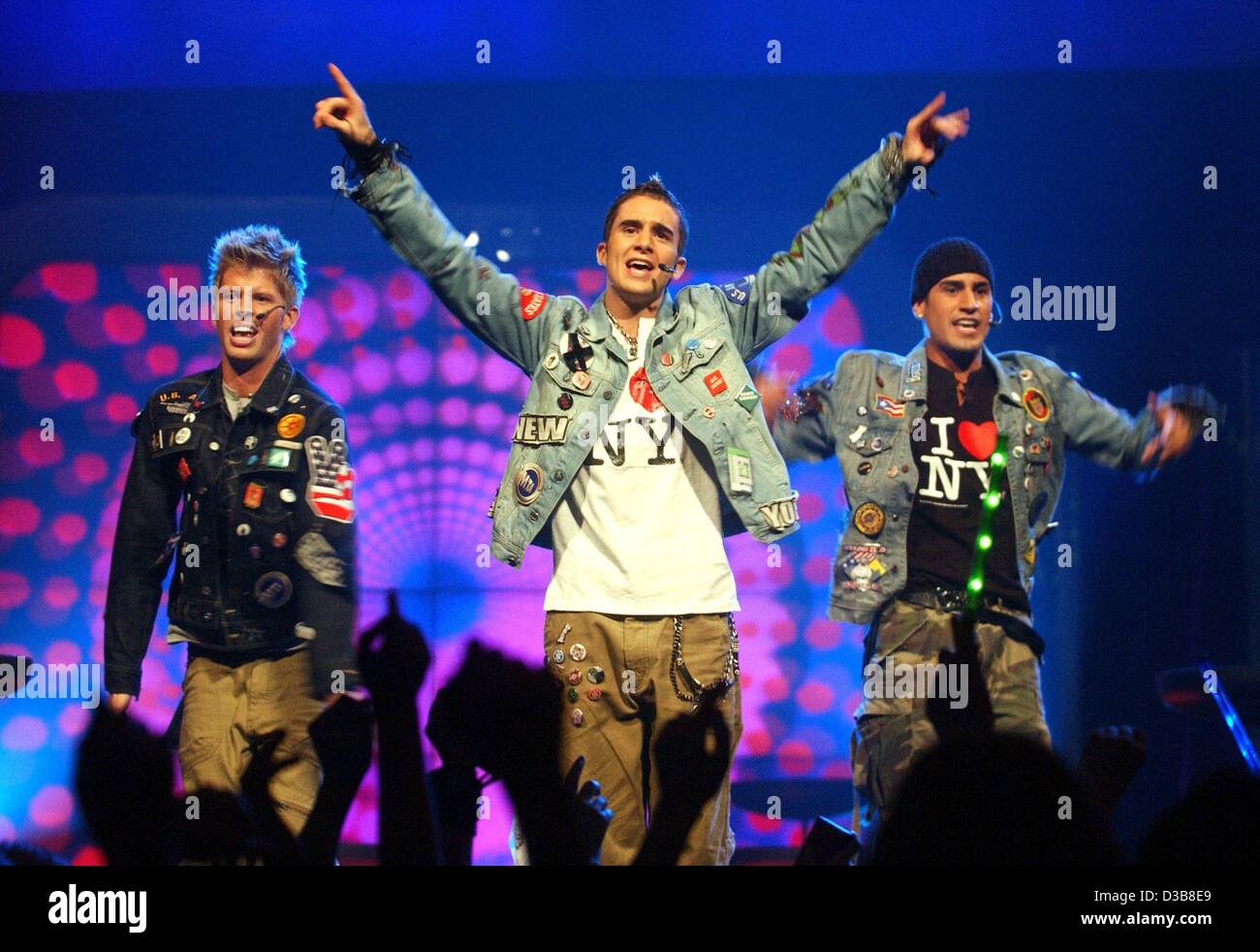 (dpa) - Blair, John and Tim (L-R) of the US boygroup B3 ('You Win Again') perform during a concert in Dortmund, Germany, 30 November 2002. Stock Photo