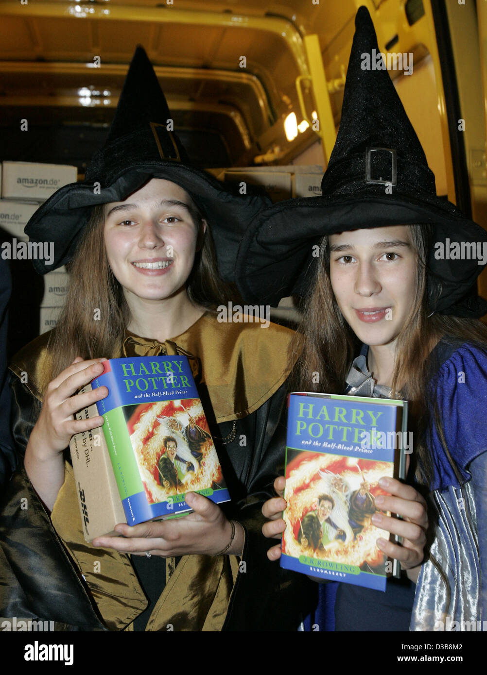 In the early morning Nadine (L) and Saskia of the Harry Potter Fan Club  hold the original English version of 'Harry Potter and the Half-Blood  Prince' in their hands in Berlin, Saturday