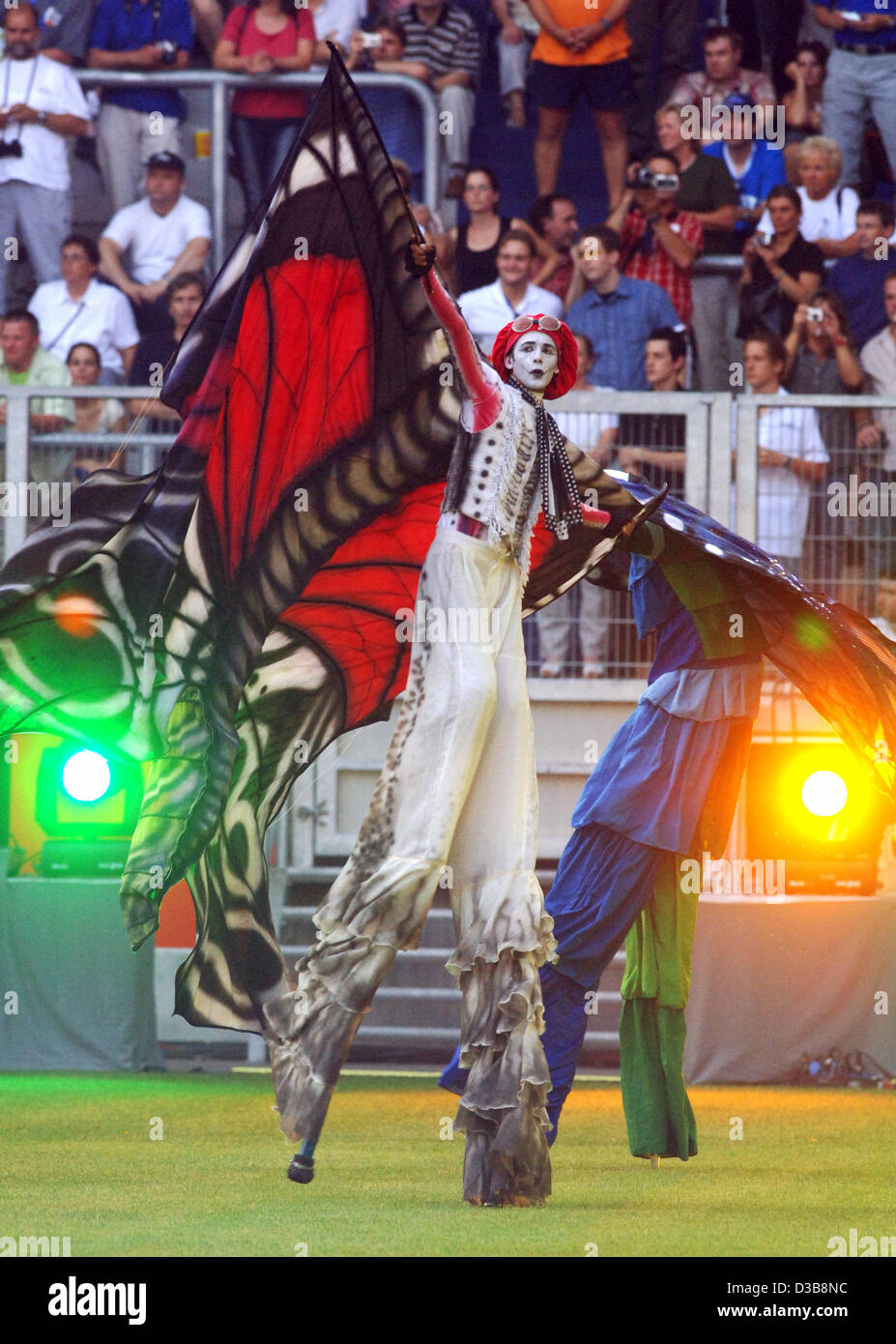 (dpa) - Actors dressed as butterflies perform on stilts during the opening of the World Games at the MSV Arena in Duisburg, Germany, 14 July 2005. The World Games sports event was officially openend with a two hour long ceremony. The World Games feature 40 non-olympic disciplines, runnig from 14 Jul Stock Photo