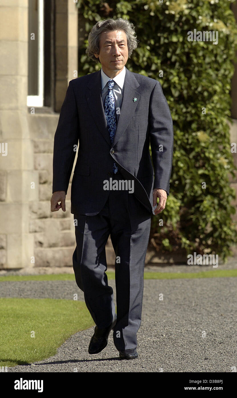 (dpa) - Japan's Prime Minister Junichiro Koizumi walks on his way to the first meeting of the G8 summit at the hotel in Gleneagles, Scotland, 07 July 2005. The leaders of the G8 countries deliberate on how to tackle poverty in the world. The schedule of the summit was changed due to the series of bo Stock Photo