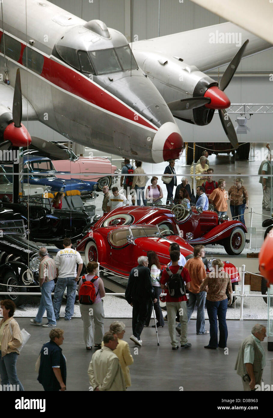 (dpa) - The picture shows visitors at the Automobile and Technology Museum in Sinsheim, Germany, Wednesday, 6 July 2005. More than 3,000 objects are on display in the exhibition hall covering 30,000 sqm. The outdoor area features the supersonic plane Concorde and a Russian Tupolev 144. The museum is Stock Photo