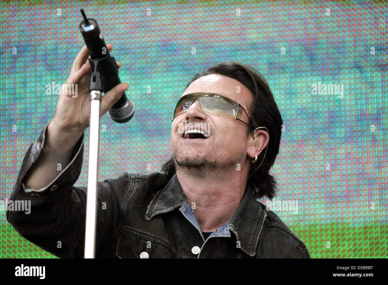 (dpa) - Bono of the rock group U2 performs during the Live 8 Concert in Hyde Park in London, 02 July 2005. The concert, held simultaneously in many cities around the world including Paris, Berlin, Philadelphia and Rome, is intended to call attention to world poverty ahead of next week's G8 meeting i Stock Photo