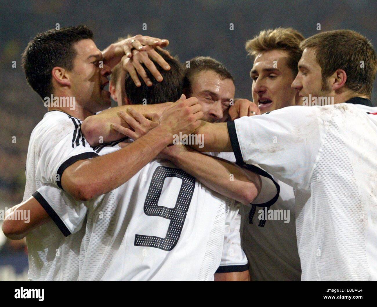 (dpa) - German goal scorer Fredi Bobic (C) jubilates with his team mates (from L:) Michael Ballack, Joerg Boehme, Miroslav Klose and Torsten Frings during the international friendly soccer match Germany against Netherlands in Gelsenkirchen, Germany, 20 November 2002. Holland went on to win 3-1. It i Stock Photo
