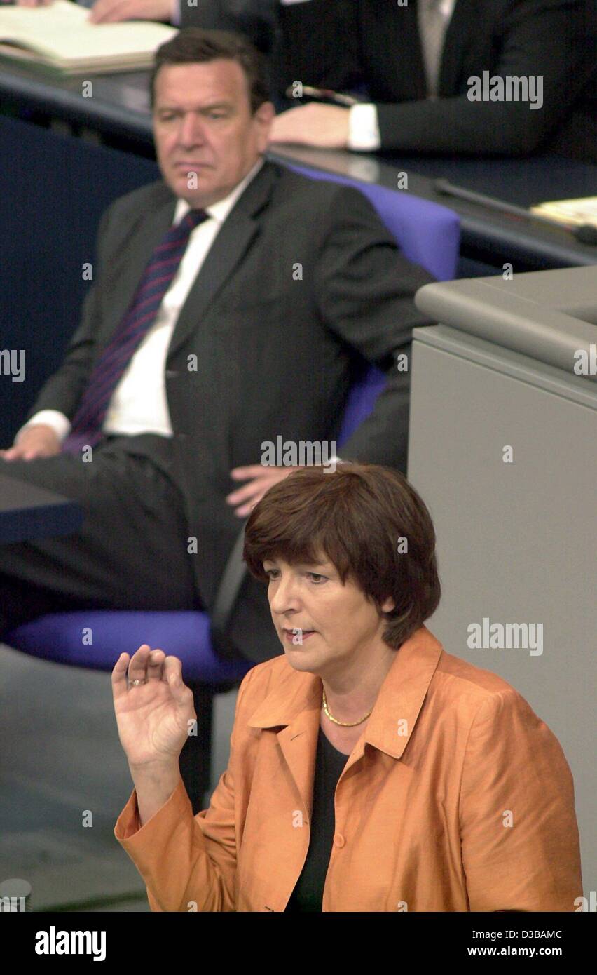 (dpa) - German Health Minister Ulla Schmidt of the German Democratic Party SPD gestures during her speech in the Bundestag in Berlin, 17 May 2001. In the background German Chancellor Gerhard Schroeder. Schmidt has been serving as Health Minister since beginning of 2001 and is to continue her work in Stock Photo