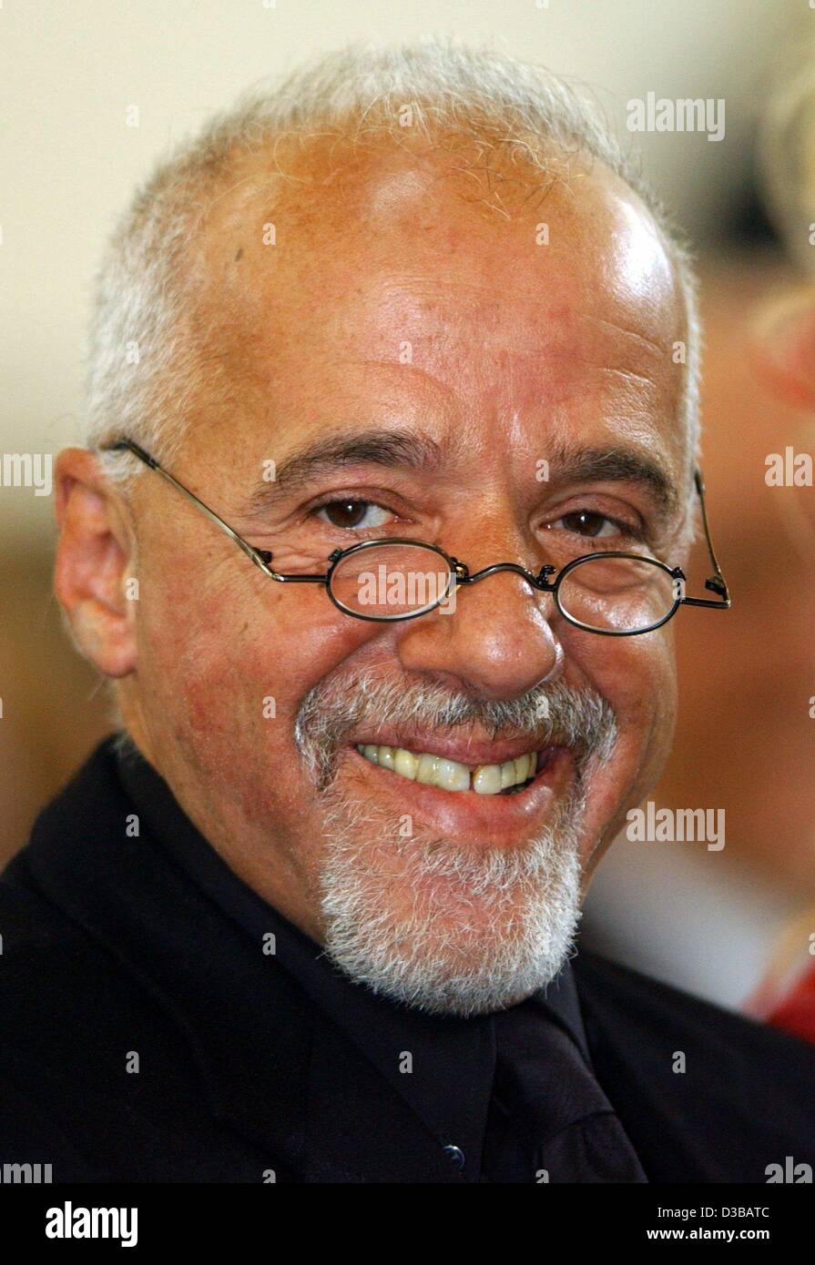 dpa) - Brazilian author Paulo Coelho ('The Alchemist: A Fable About  Following Your Dream'/'El Alquimista: Una Fabula Para Seguir Tus Suenos',  'Veronika Decides to Die') smiles during the ceremony of the Planetary
