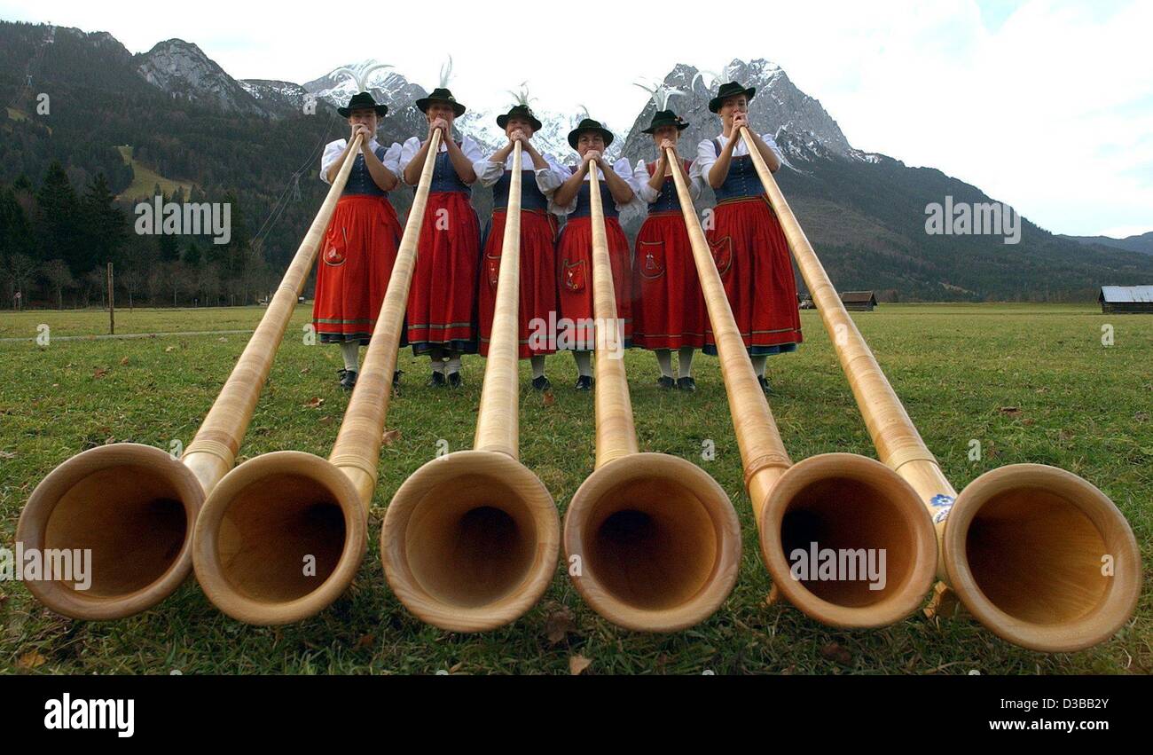 (dpa) - For men only? Apparently not: the first group of female alphorn musicians (Sabine Pabst, Stephanie Krippner, Elisabeth Heilmann-Reimche, Regina Goestl, Antonia Bauer and Martina Arnold) pose with their instruments in Garmisch-Partenkirchen in Bavaria, 16 November 2002. To get a sound out of  Stock Photo