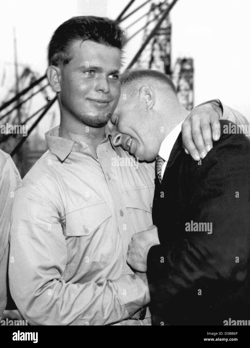 (dpa files) - A happy father: Walter Anders hugs his 18-year-old son Folkert, one of the six survivors of the 'Pamir', aboard the US troop-carrier 'Geiger' in the harbour of Casablanca, 28 September 1958. 80 of the 86 seamen perished when the sailing ship used for training sank 21 September 1957 in  Stock Photo