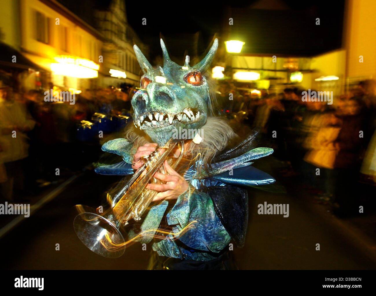 (dpa) - During the international Guggen Music festival a musician marches in a colourful costume through the streets of Bad Breisig, Germany, 9 November 2002. Some 1000 participants from Germany, Austria and Switzerland took part in the festival. 'Gugaaggeri Musig' is originally a characteristic fea Stock Photo