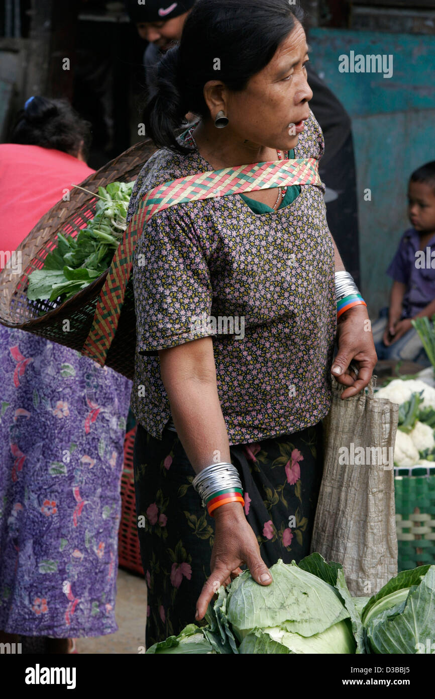 Tribal women buying cabbage on the vegetable market in Ruma Bazaar, Chittagong Hill Tracts, Bangladesh Stock Photo