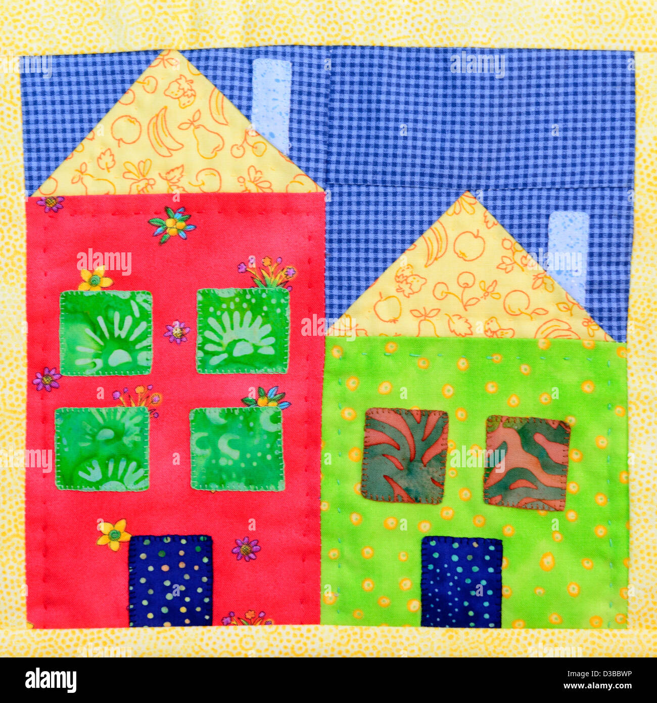 Close up of patchwork houses on a quilt. Stock Photo
