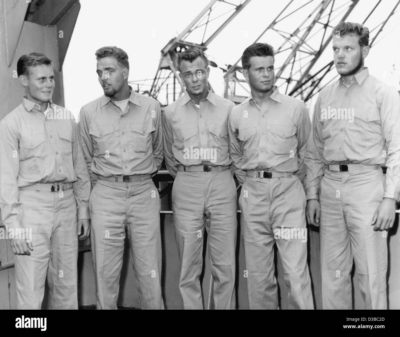 (dpa files) - Klaus Fredrichs, Karl-Otto Duemmer, Karl-Heinz Kraaz, Folkert Anders and Hans Wirth (L-R), five of the six survivors of the 'Pamir', stand aboard the US troop-carrier 'Geiger' in the harbour of Casablanca, 28 September 1958. 80 of the 86 seamen perished when the sailing ship used for t Stock Photo